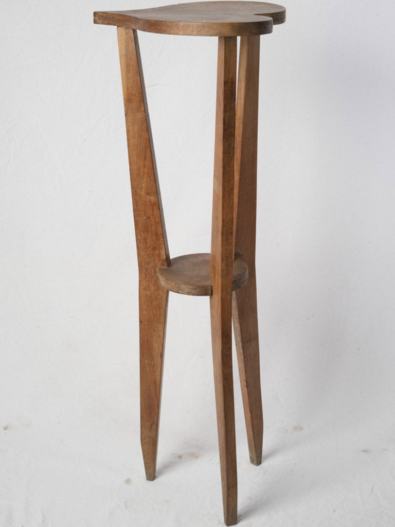 Warm patina wooden tripod pedestal  