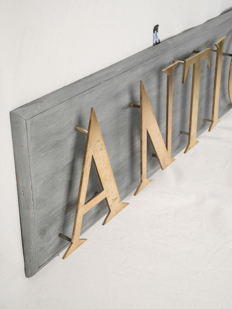 Mid 20th Century French Antiquité Shop Sign in Gilt Brass Letters on Wood - 80¼"