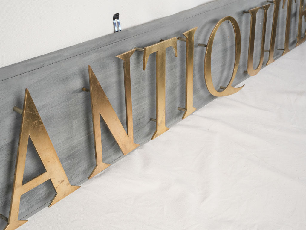 Mid 20th Century French Antiquité Shop Sign in Gilt Brass Letters on Wood - 80¼"