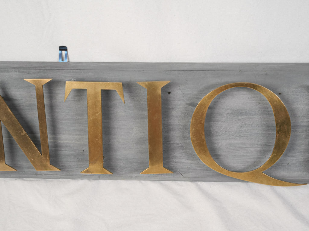 Mid 20th Century French Antiquité Shop Sign in Gilt Brass Letters on Wood - 80¼"