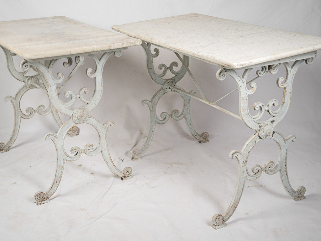 Artful scrollwork bases tables