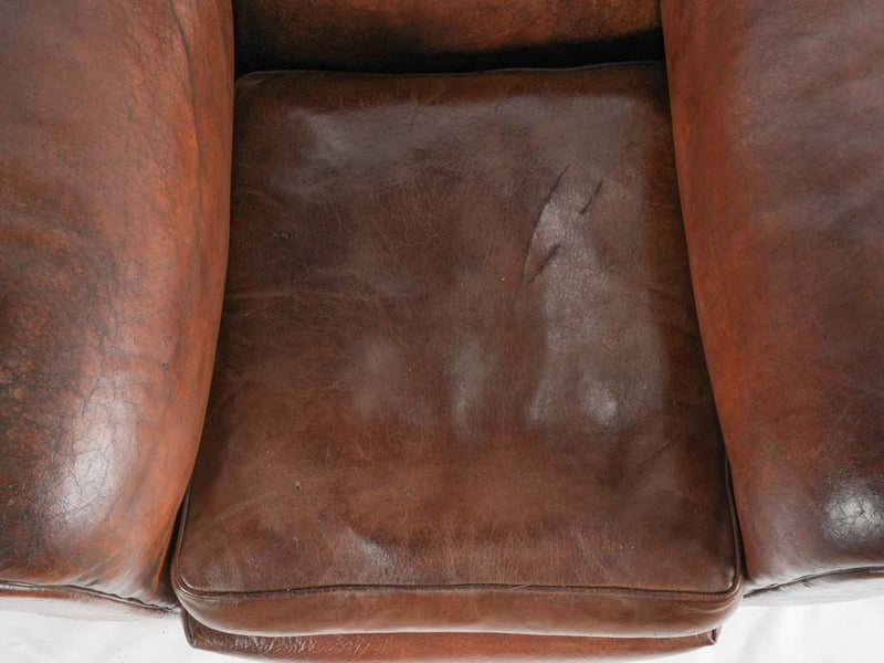 Large 1930s Havana moustache back leather club chair