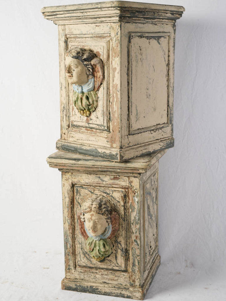 Antique polychrome cherub-head stands  