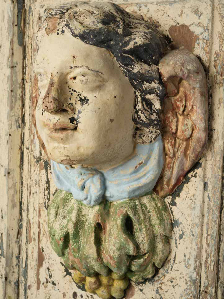 Ivory-tone relief mask pedestal  