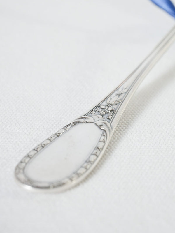 Pretty serving spoon w/ floral trophy