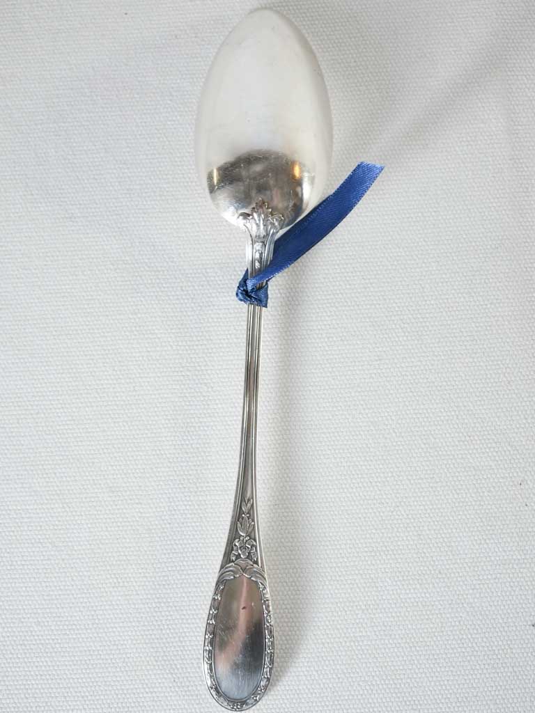 Pretty serving spoon w/ floral trophy