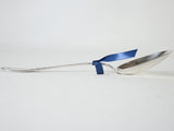 Pretty serving spoon w/ floral trophy