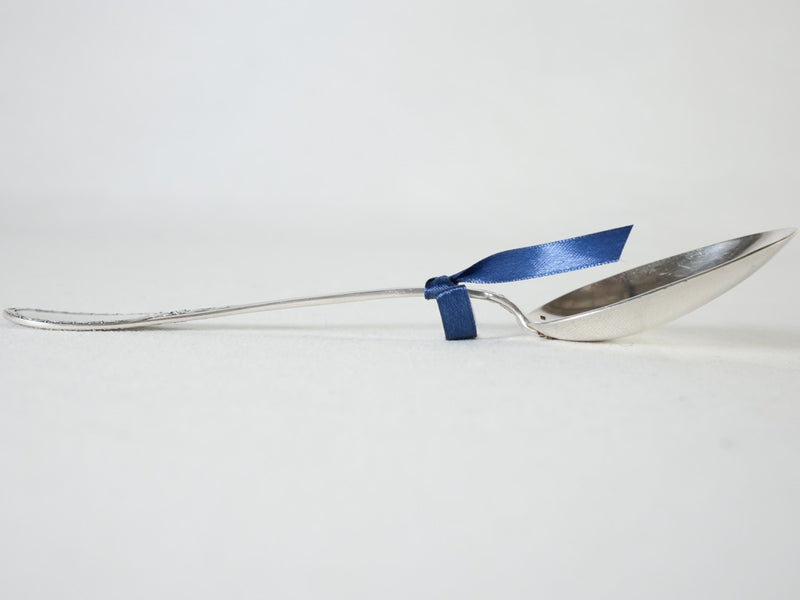Pretty serving spoon w/ floral trophy