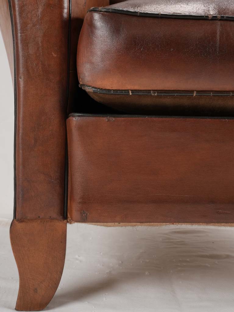 Reserved LM Petite French leather club chair w/ moustache back - 1930s