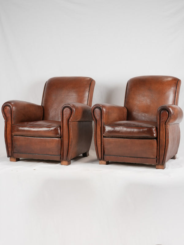 Vintage restored French leather club chairs