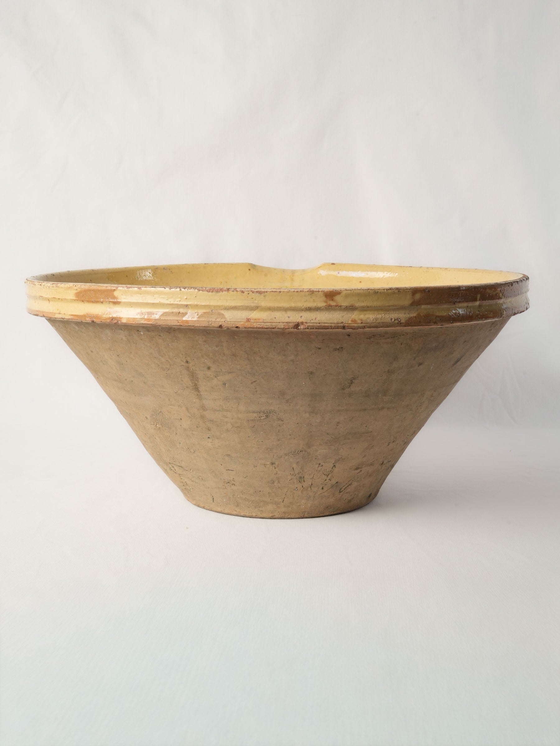 Rustic sandy-toned utilitarian dish