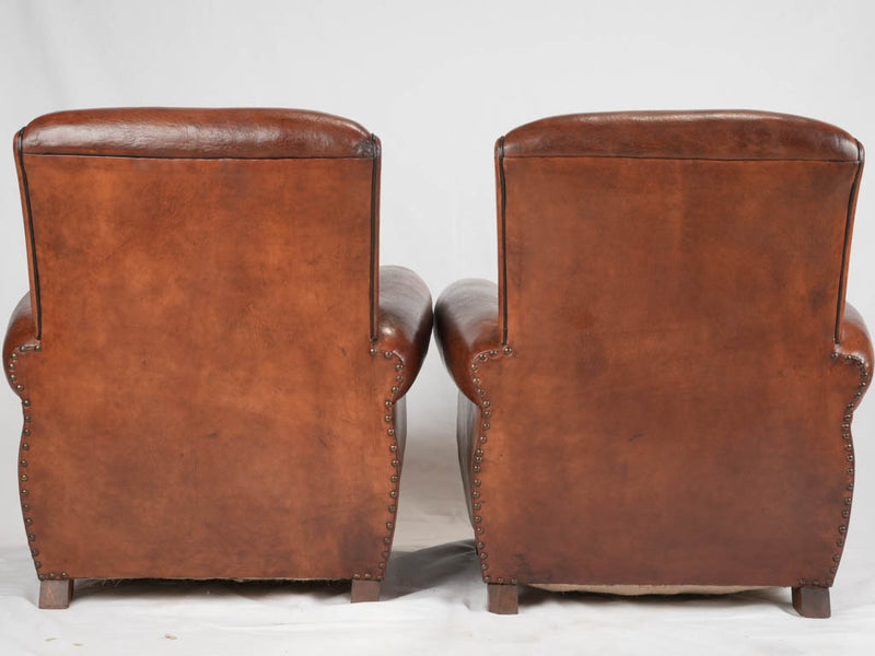 Stately antique leather Havana chairs