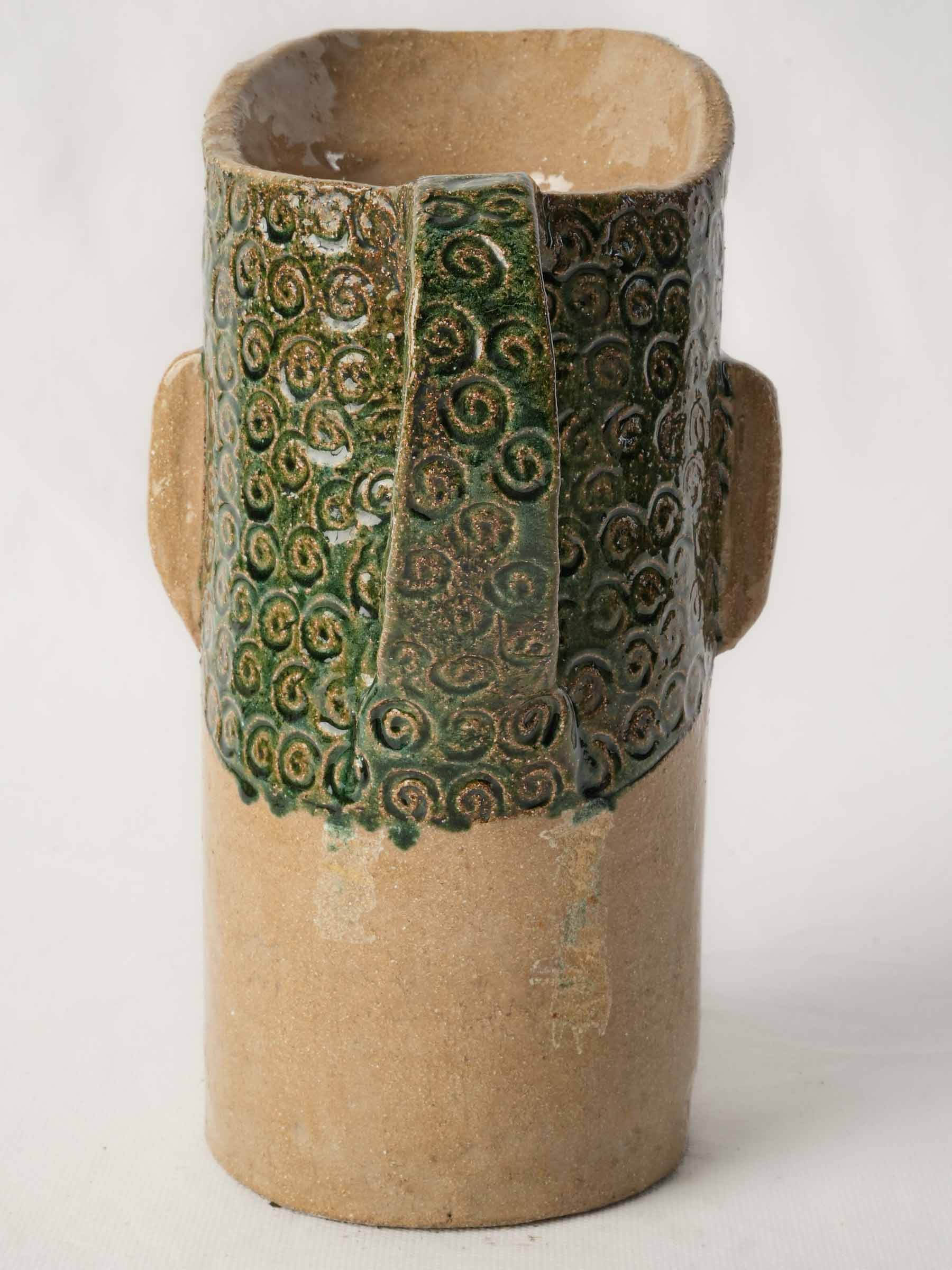 Stylized human head stoneware  