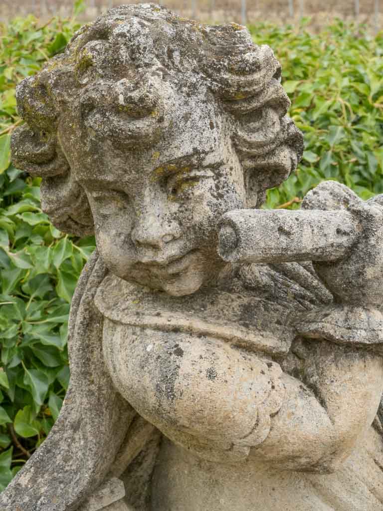 Rustic weathered cherub statue for gardens