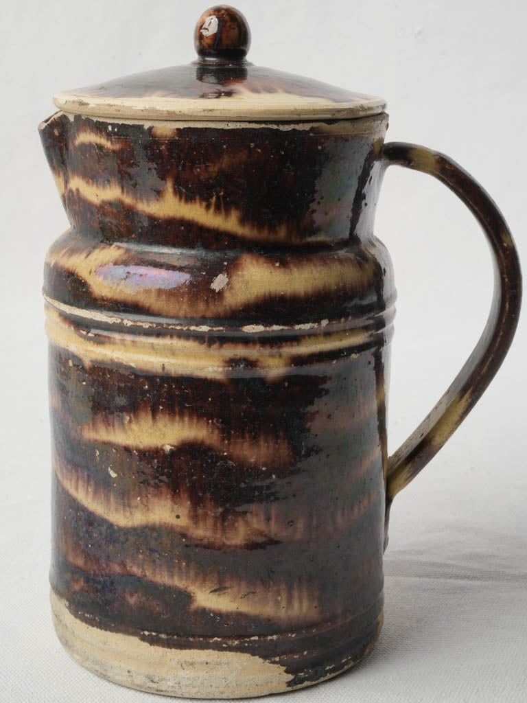 Aged earthen brown coffee pot  