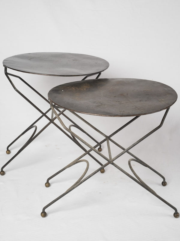 Pair of round garden tables w/ black patina
