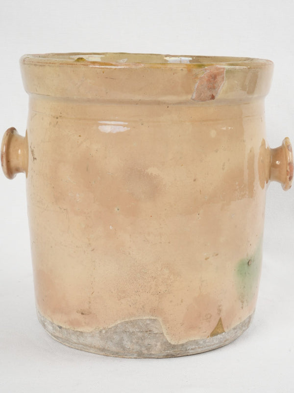 Timeworn yellow French ceramic preserving pot