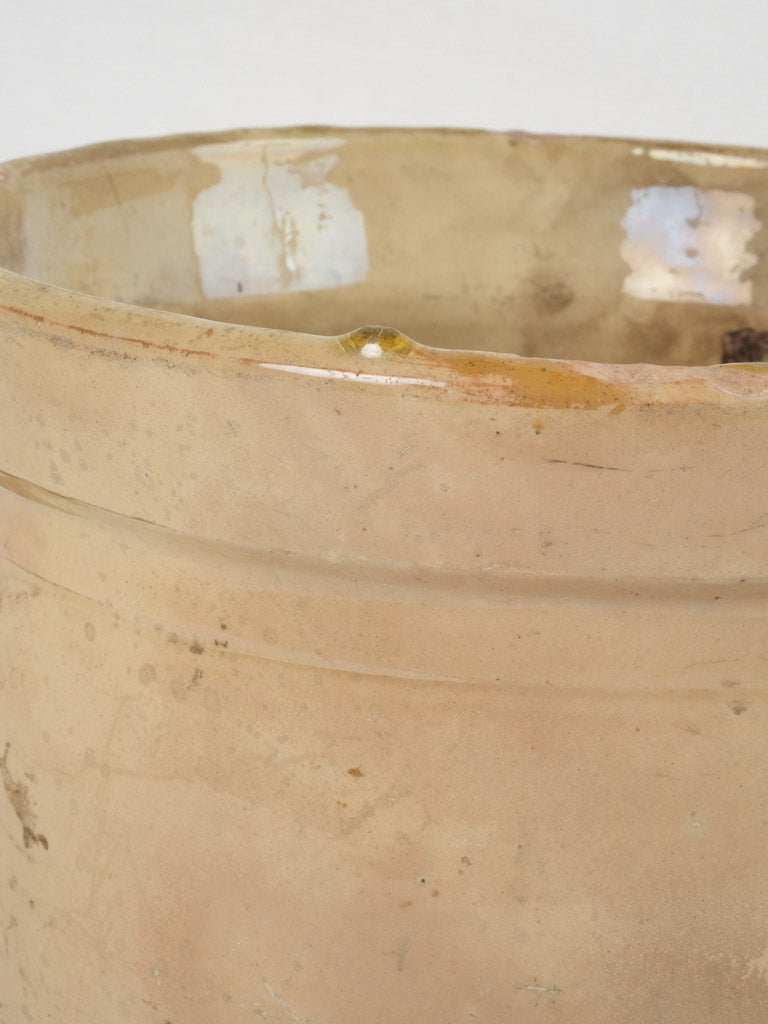 Old-fashioned yellow cookware with patina