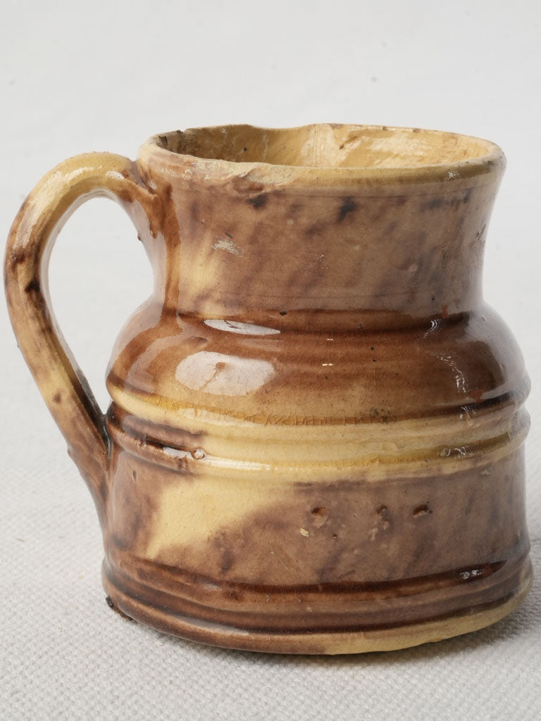 Honey-brown glazed pottery creamer