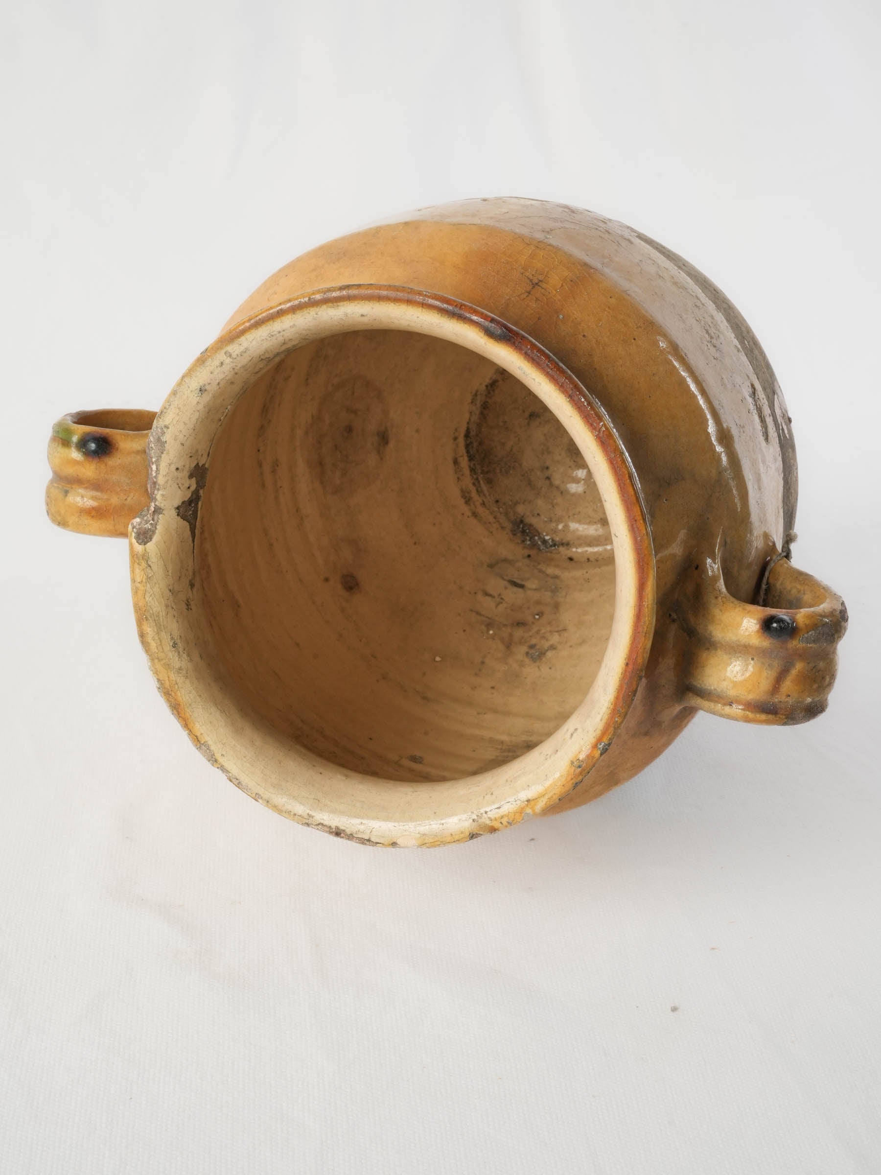 Ochre and green streaked pottery