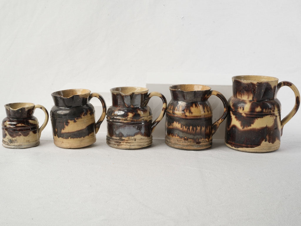 Graduated Set Of Five Early 20th Century Dieulefit Ceramic Pitchers