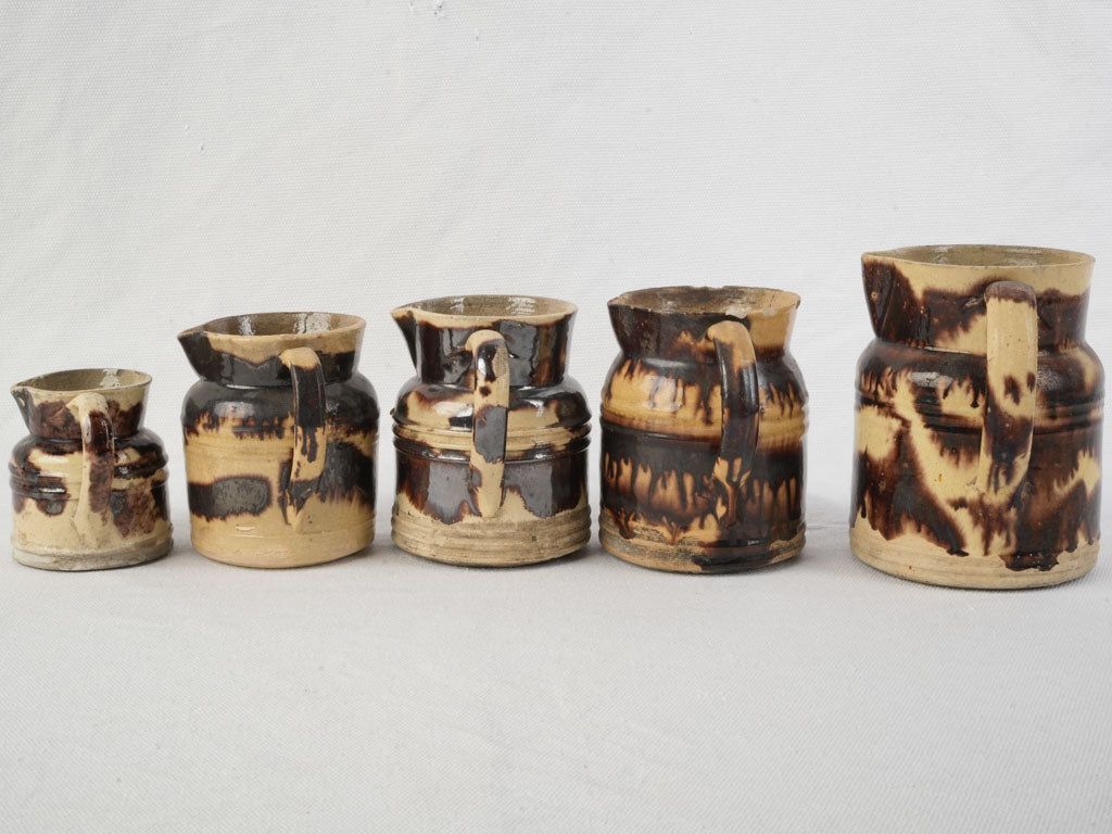 Graduated Set Of Five Early 20th Century Dieulefit Ceramic Pitchers