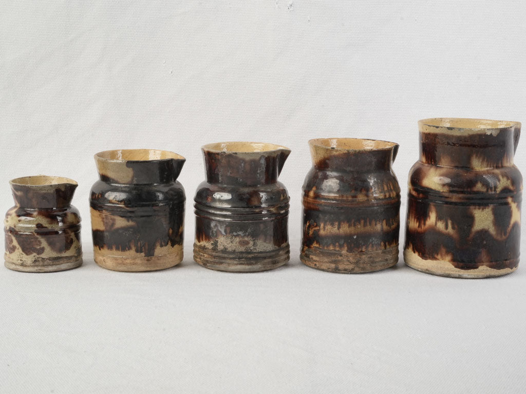 Graduated Set Of Five Early 20th Century Dieulefit Ceramic Pitchers