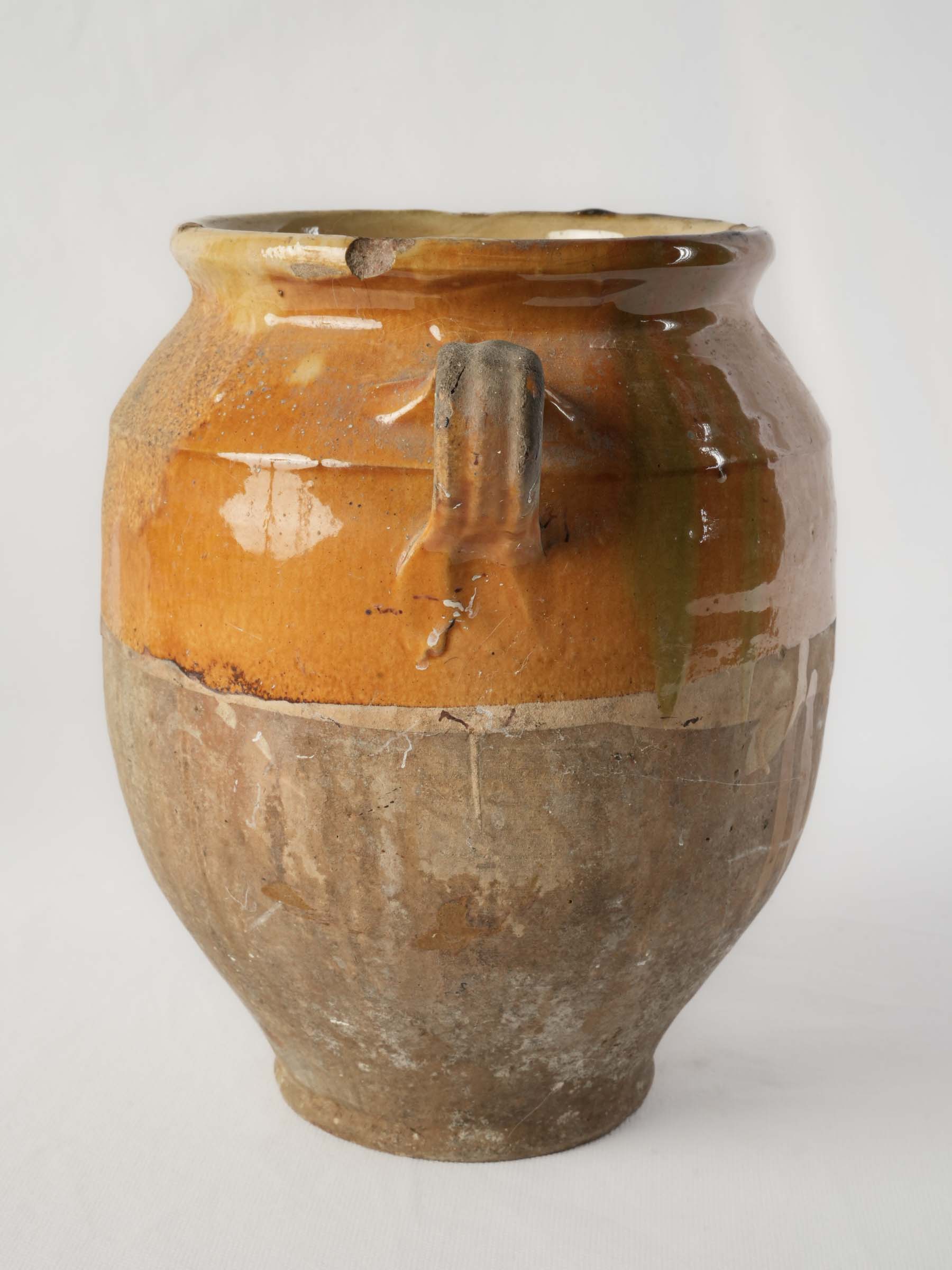 Weathered honey-ochre glazed pot