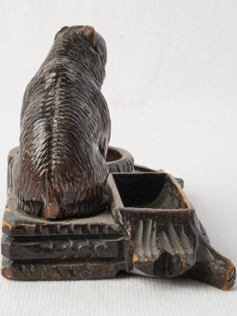 Wood-carved contemplative bear inkwell  