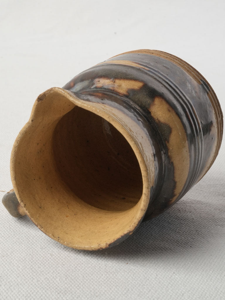 Dark-toned historic pottery piece