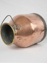 Elegant brass-trimmed copper vessel