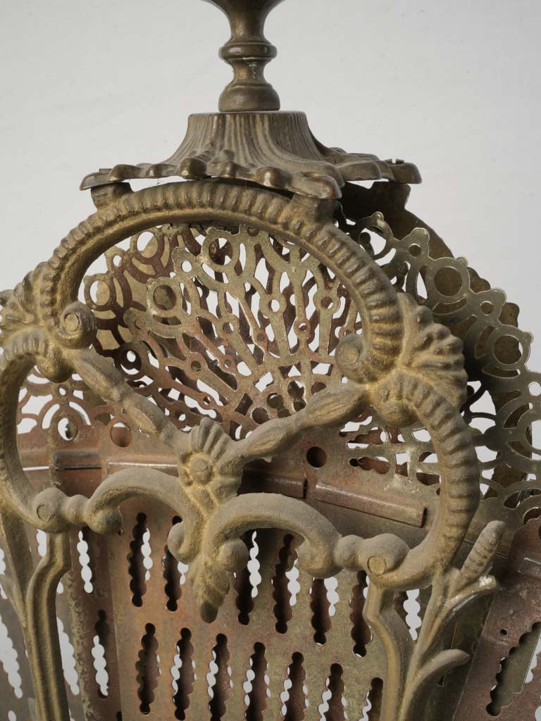 Shimmering oxidized brass fireplace screen