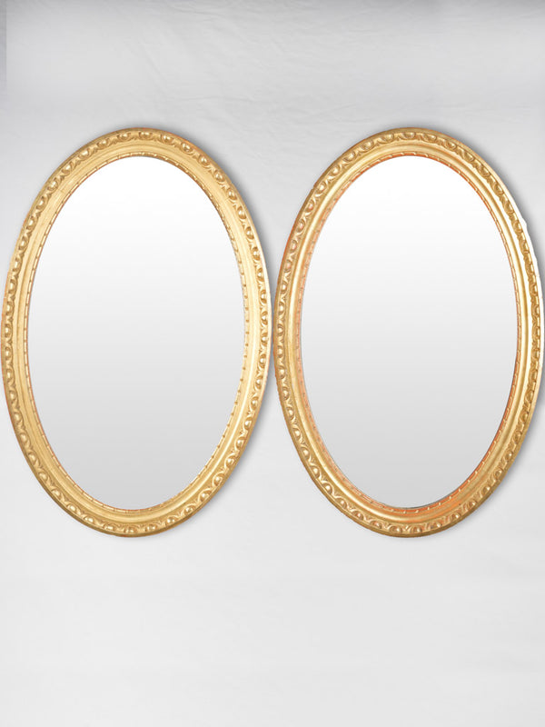 Antique gilded French oval mirrors