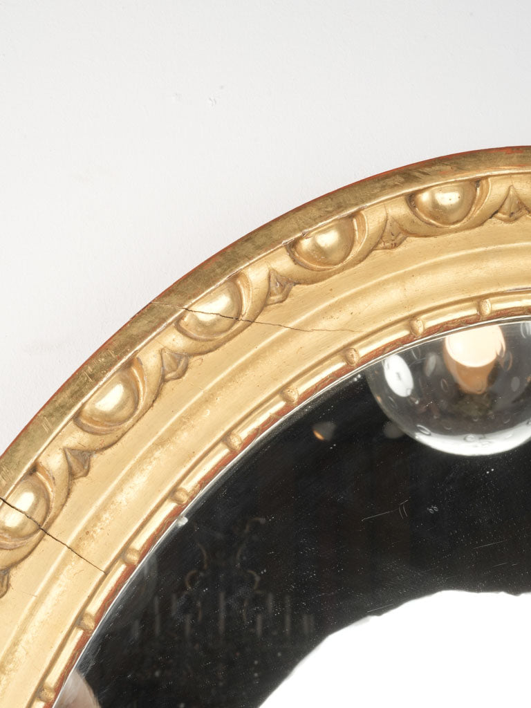 Aged gold leaf oval mirrors