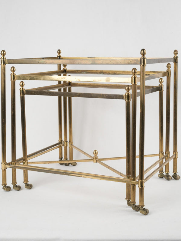 Vintage brass nesting tables with wheels