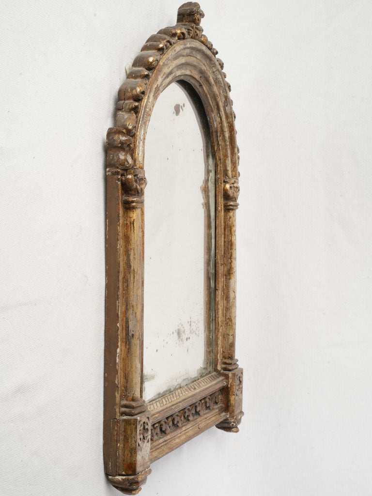 Aged wooden chapel-shaped mirror