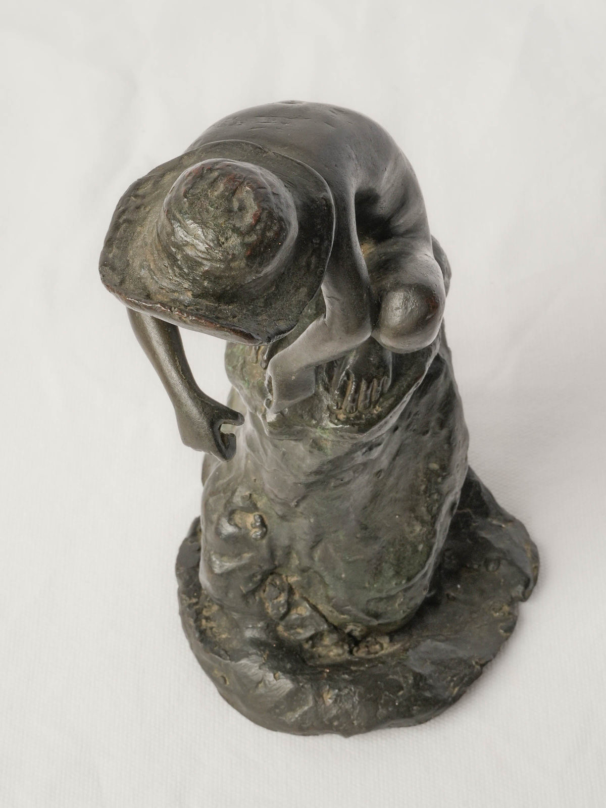 Charming Petite Black-Patinated Bronze Figure of a Crouching Boy on a Rocky Outcrop - 9½"