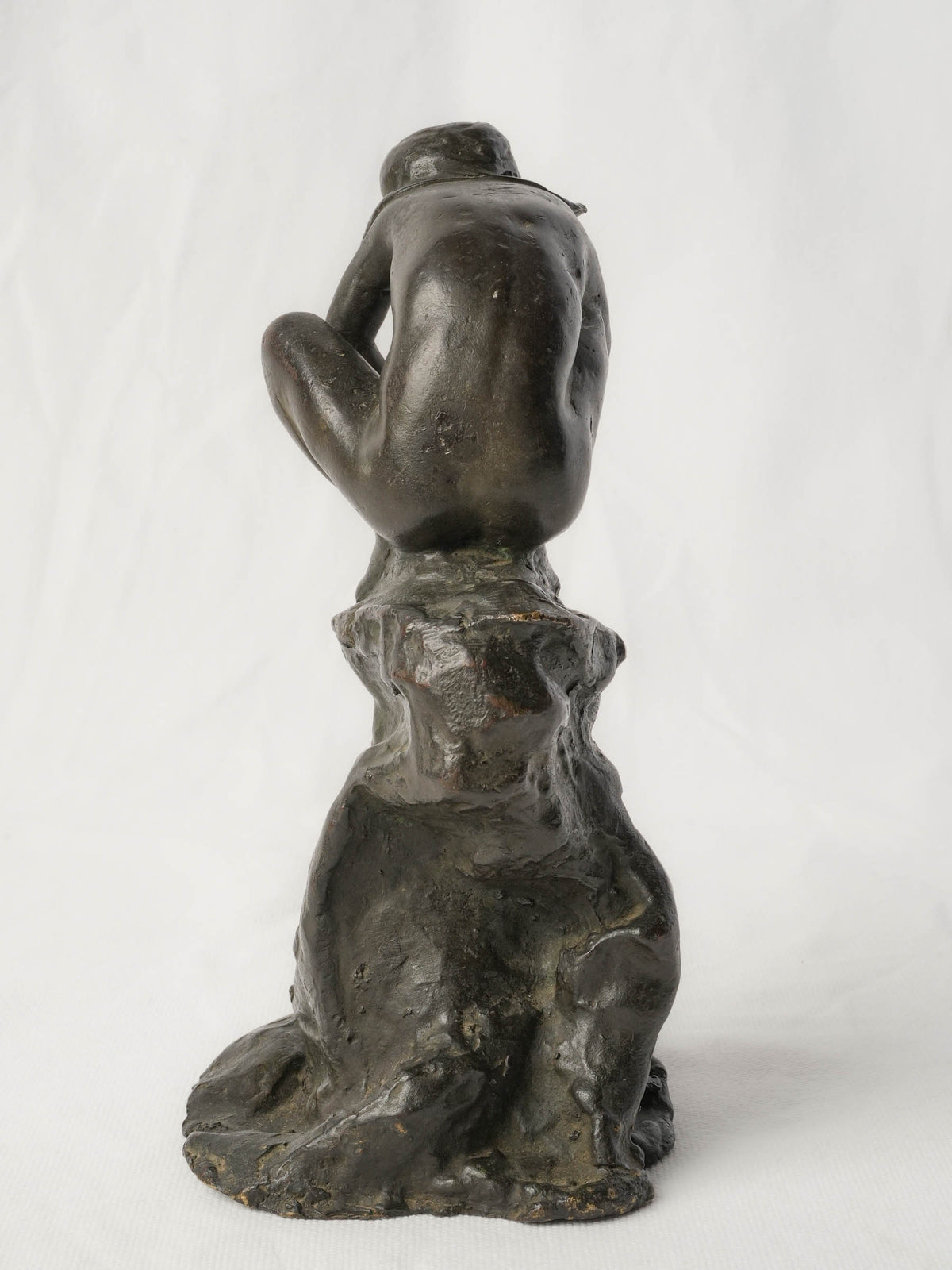 Charming Petite Black-Patinated Bronze Figure of a Crouching Boy on a Rocky Outcrop - 9½"