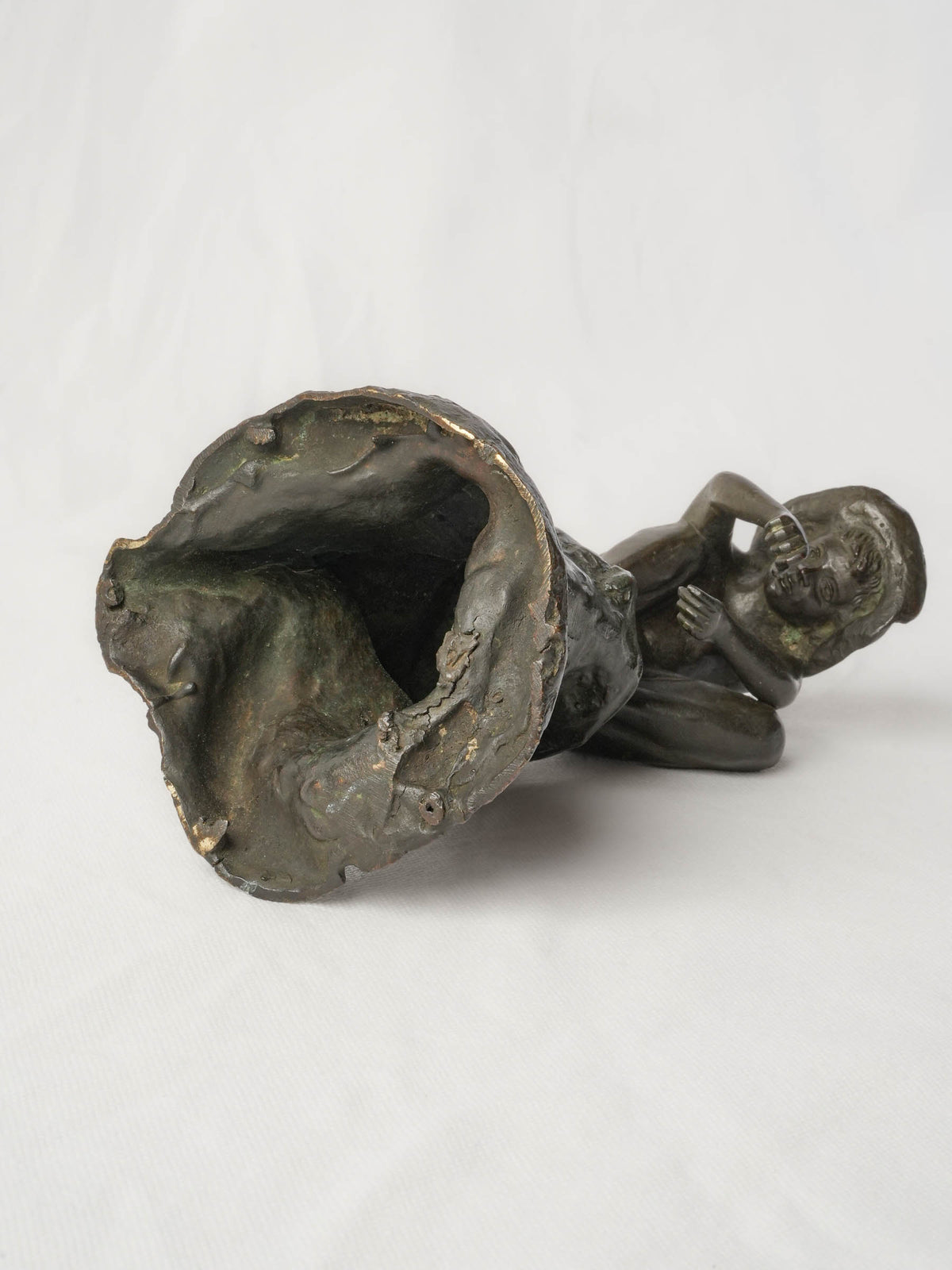 Charming Petite Black-Patinated Bronze Figure of a Crouching Boy on a Rocky Outcrop - 9½"