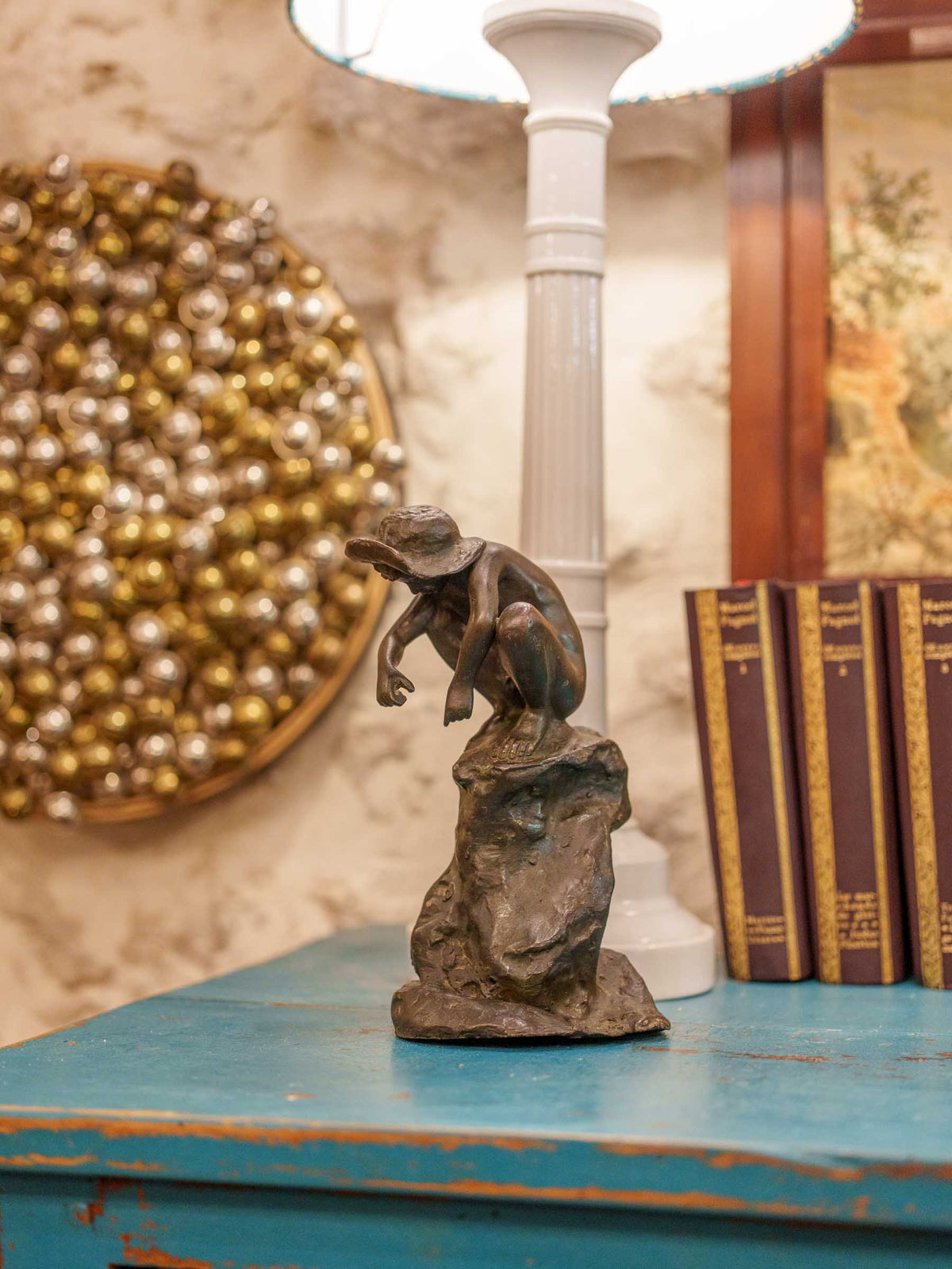 Charming Petite Black-Patinated Bronze Figure of a Crouching Boy on a Rocky Outcrop - 9½"