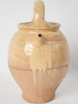 Historical pale tan-yellow water pitcher