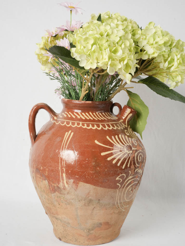 Aged red-brown French pottery cruche