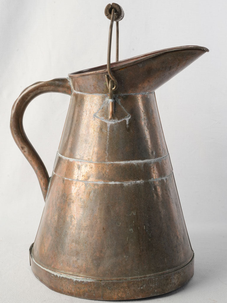 Patina-finished vineyard pouring vessel  