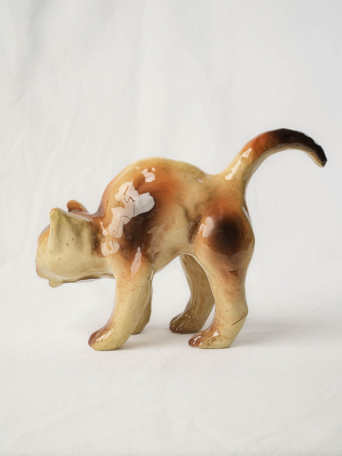 Playful Glazed Ceramic “Scaredy-Cat” Kitten, c. 1920 - 8" x 10¼"