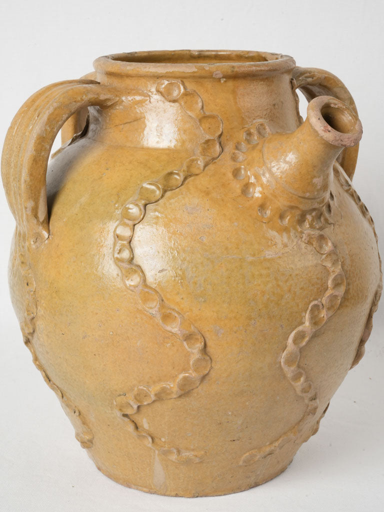 Large, yellow-glazed, 19th-century French terracotta oil jar