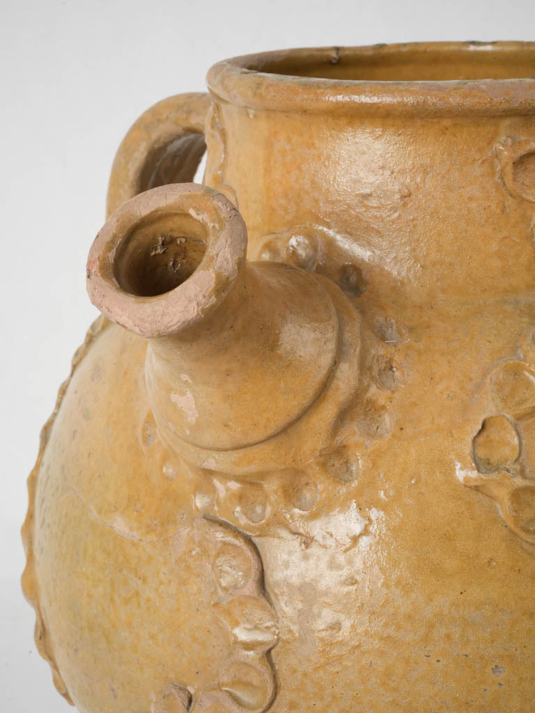 Ornate, vintage, yellow-glazed French terracotta oil jar