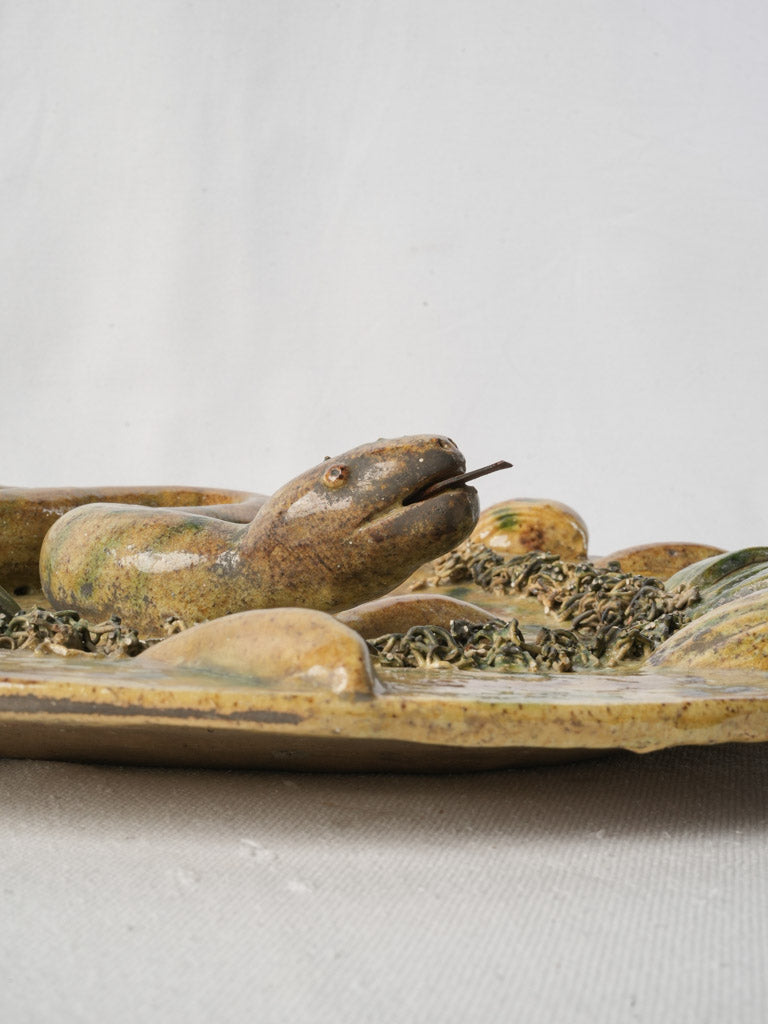 Naturalistic relief snake motif plaque  