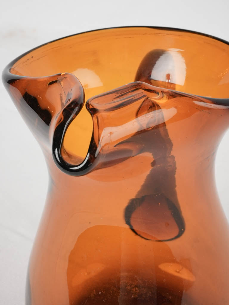 Festive amber-toned glass pitcher