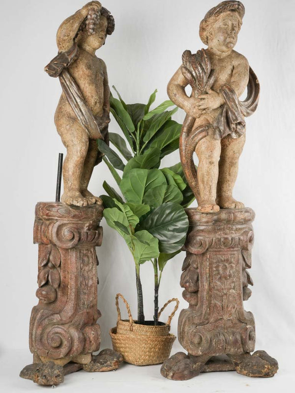 Vintage, Bacchanalia-themed wood cherub sculptures