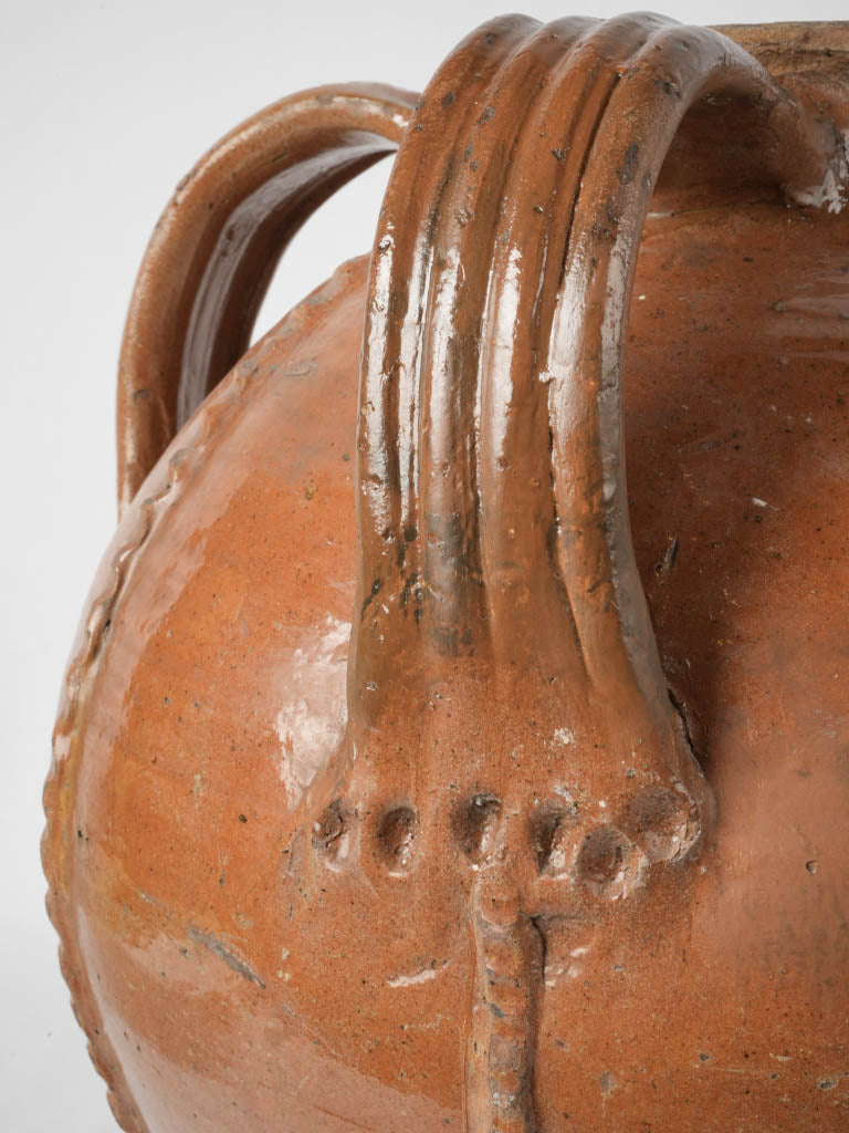  Aged, timeworn terracotta pouring spout jar